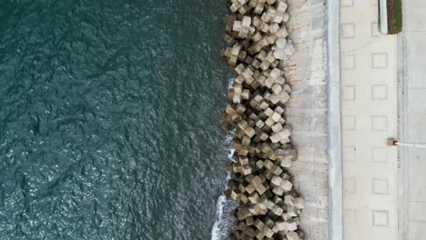 Top-Down-Aerial-View-of-Concrete-Tetrapods-lined-up-against-Philippine-Island-Seawall-for-storm-surge-and-erosion-protection