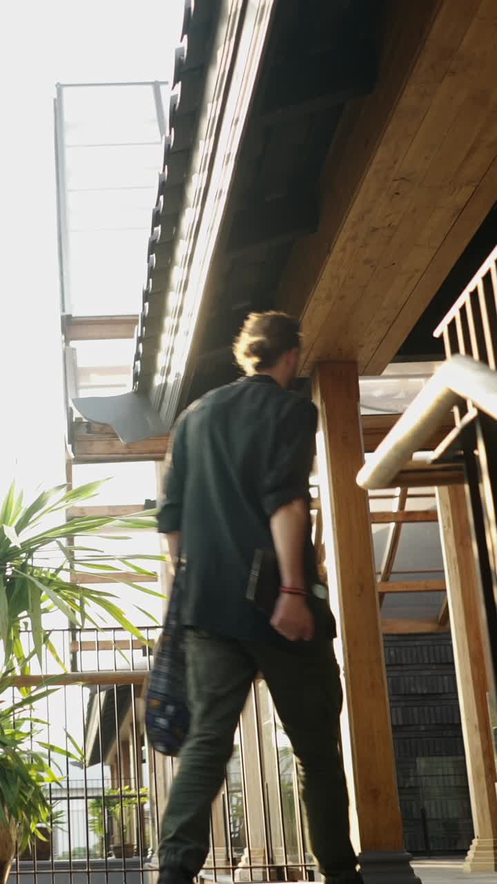 A person walks up a flight of stairs indoors