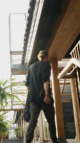 a person walks up a flight of stairs indoors