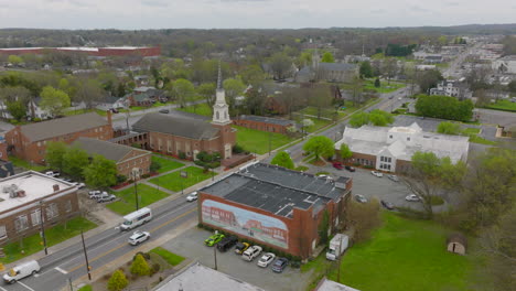 push towards street with church and buildings in thomasville, north carolina on a spring day