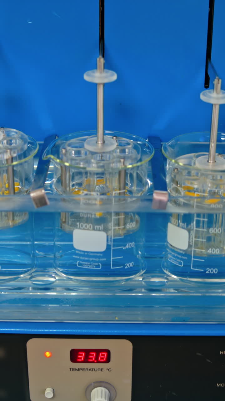 Production line in pharmacy industry. Medical pills industry factory and production indoor. Vertical video