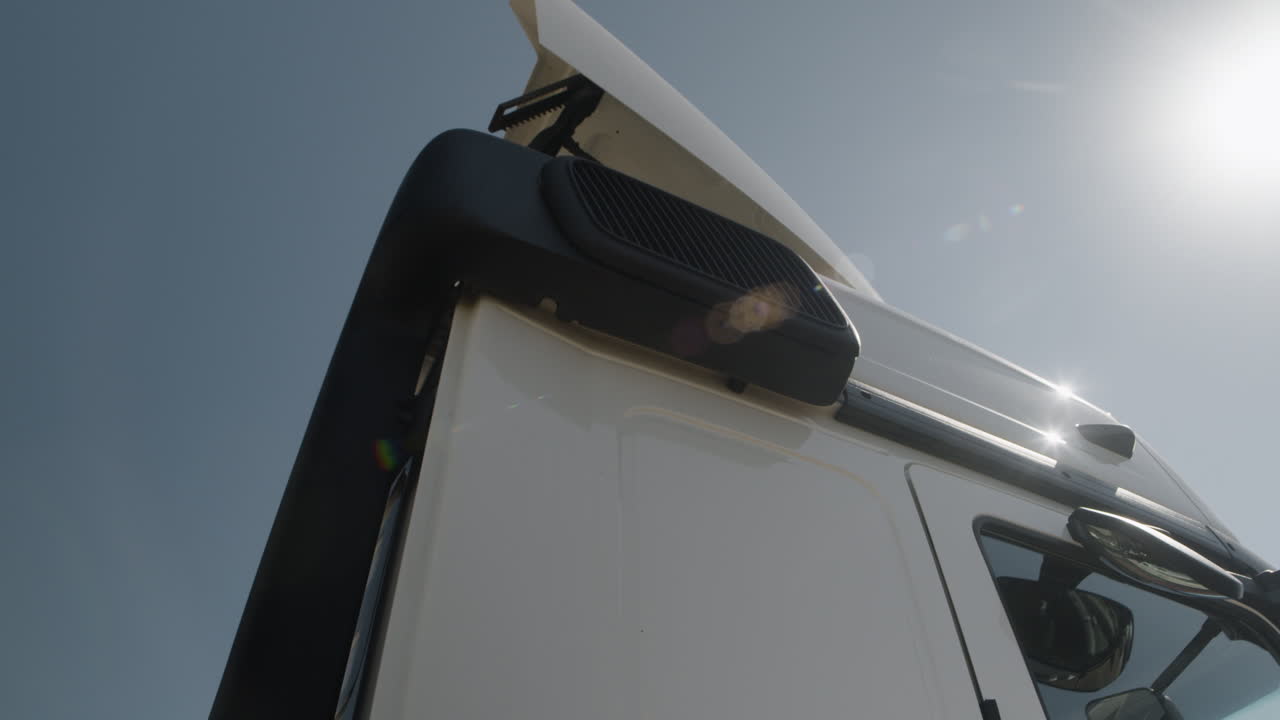Close-up of a truck cab against a clear sky