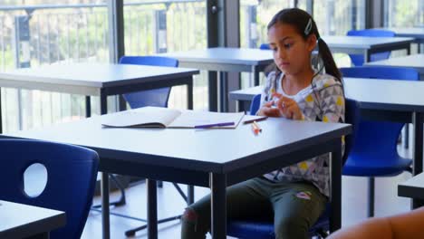 Schoolkids-studying-at-desk-in-the-classroom-at-school-4k