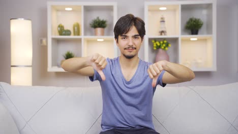 man looking at camera with a negative expression.