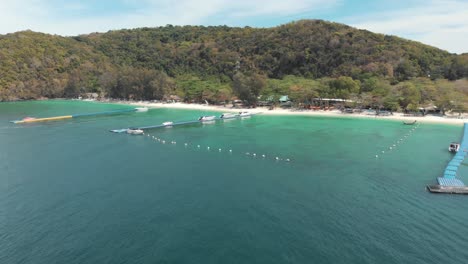 Aerial-approaching-the-pristine-beach-of-Coral-Island,-Thailand