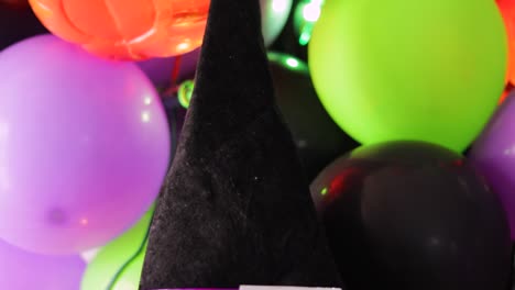 Low-angle-shot-showcasing-a-witch-hat-atop-a-pumpkin-as-part-of-Halloween-decor