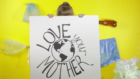 girl activist holding poster love your mother earth. plastic nature pollution