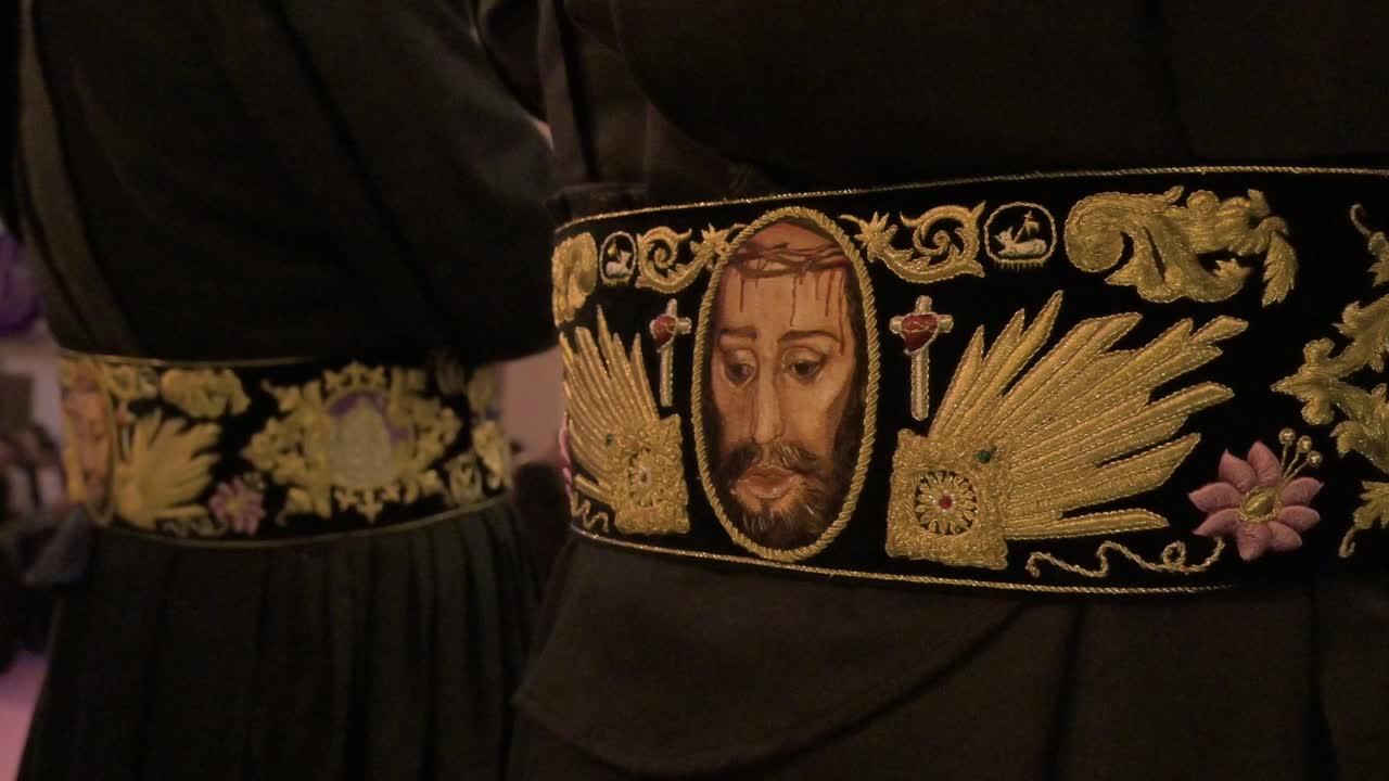 Detailed close up of a penitent's belt with Jesus Christ's face during the Holy Week celebration