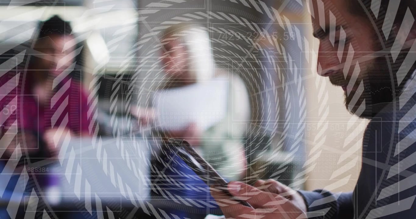 Man tapping phone while camera widening showing biz team reviewing docs at laptop overlay rotating