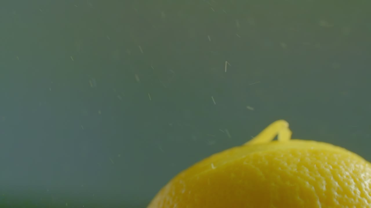 A Kitchen Tool Pulls Zest Off of a Lemon