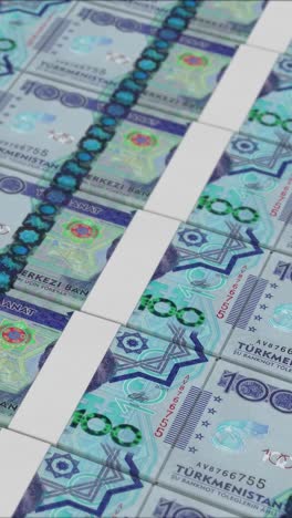 video vertical de billetes de 100 manat de turkmenistán impresos por una imprenta de dinero