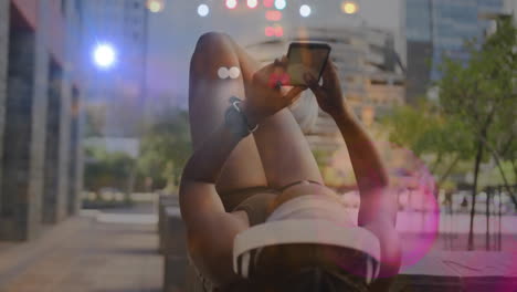 woman lying on bench interacting with smartphone under sunlight, overlaying data graphs for fitness