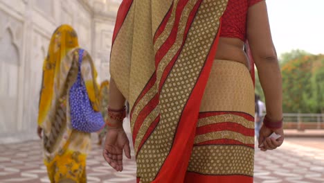 traditionally dressed indian lady walking