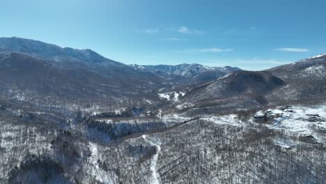 Aerial-establishing-shot-of-Japan-snowy-valley-near-the-Nagano-Myoko-Yamanochi-region