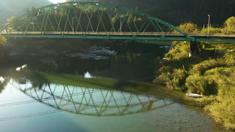 Sunrise-over-peaceful-bridge-in-rural-Gifu-Japan,-Aerial-Tilt-Shot-in-morning