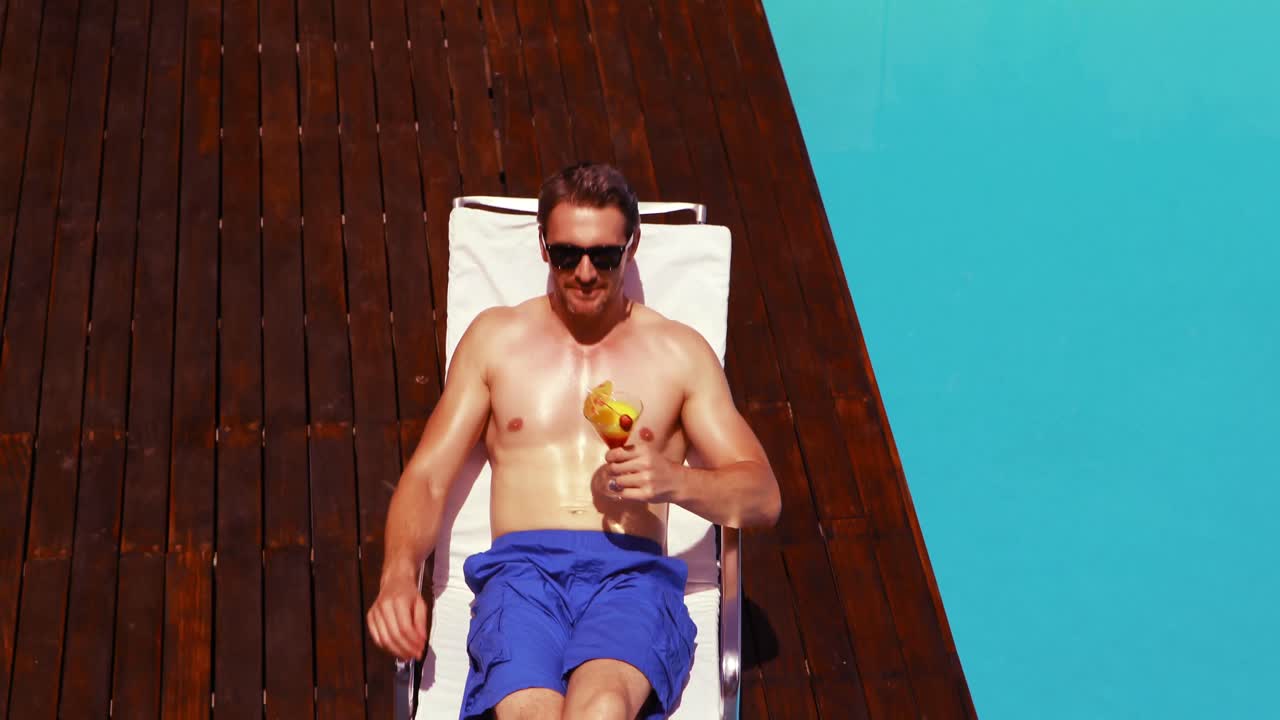 Handsome man drinking cocktail