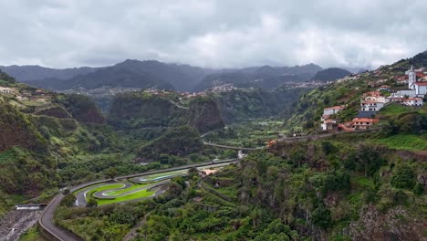 santana, madeira drone hyperlapse capturing urban life, moving clouds, and car on streets