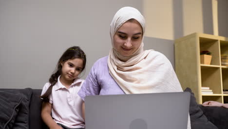 mother and daughter in the living room at home