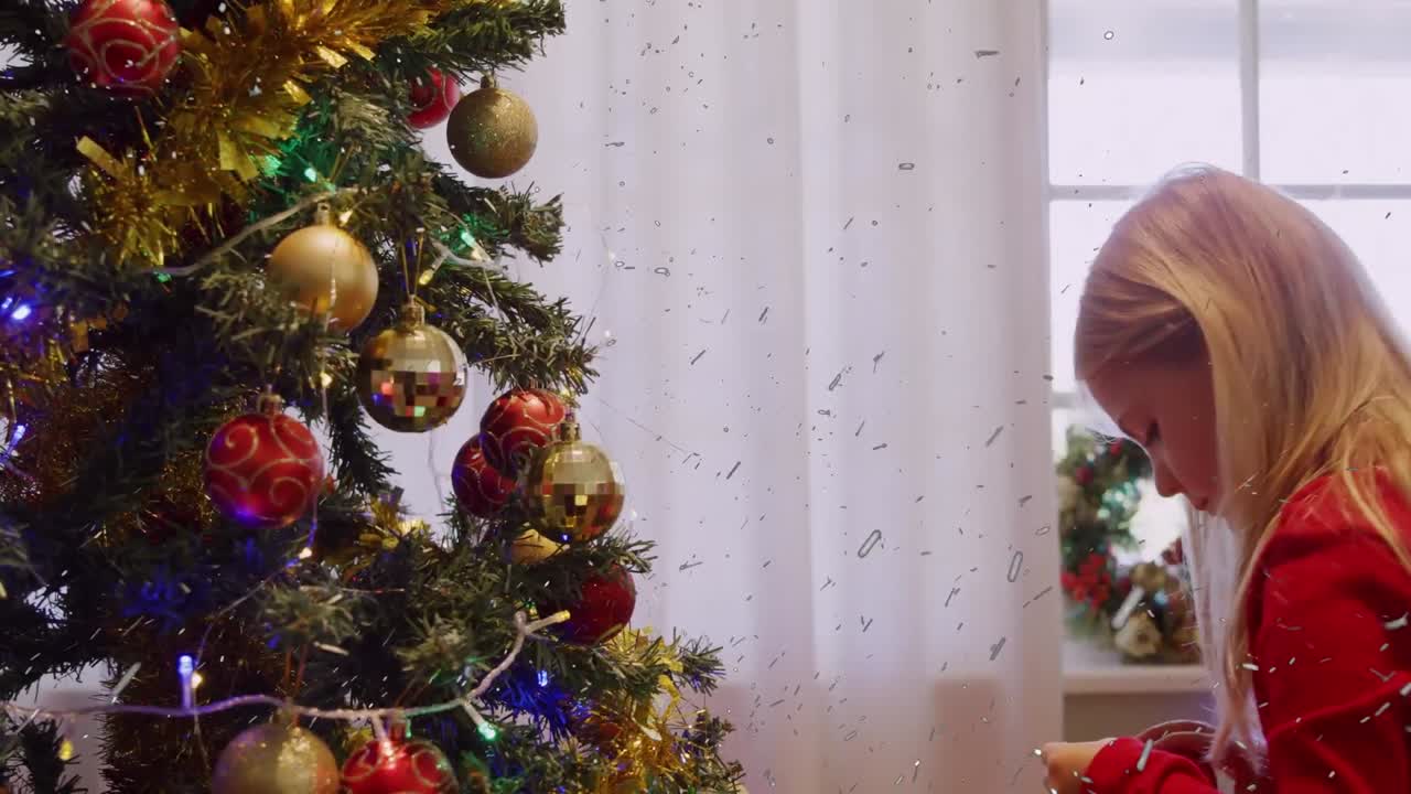 Animation of confetti over christmas tree and caucasian girl
