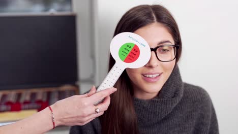 beautiful-girl-trying-on-new-glasses-and-checking-her-new-eyesight