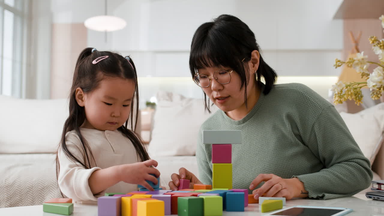 Mother and Daughter Playing with Blocks