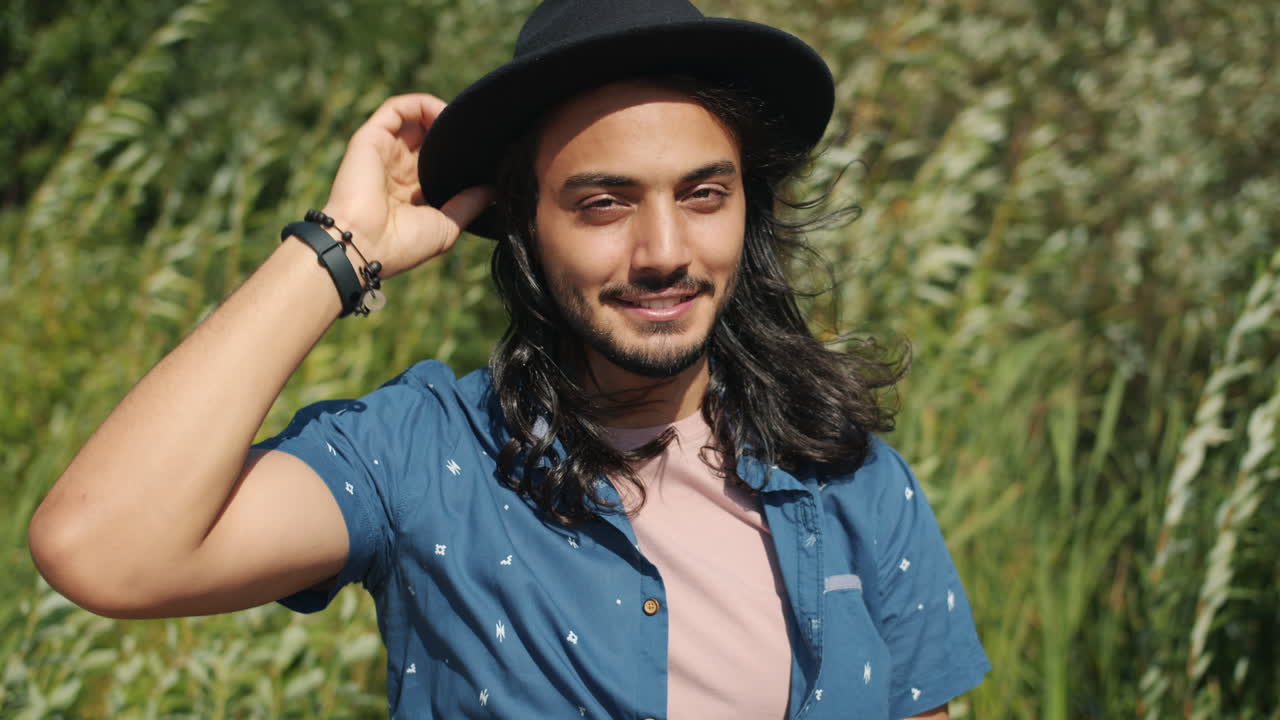 Man with a hat in nature