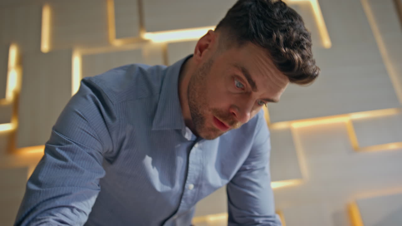 Focused architect drawing blueprint working in engineering office close up.