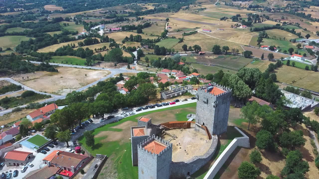 Montalegre Castle in Montalegre, Portugal  - Drone rotation shot panoramic view of the village