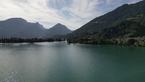 scenic mountain landscape in switzerland green hills and pine tree forest the concept of nature view natural life and water sport in summer