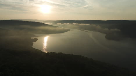 slow flyover lake fort smith state park misty summer sunrise, arkansas, usa - aerial