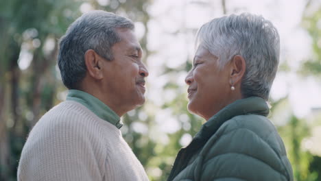 romantic senior couple kissing on the lips