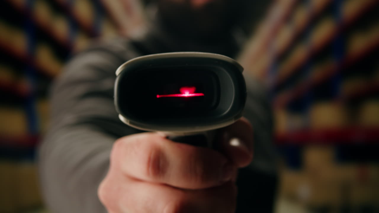 Scanner scan delivery box in storage, E-commerce shop, man packing goods and clothes second hand delivery market, courier Packaging and Shipping Workspace with Supplies and Technology, online sales.