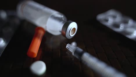 Closeup-Of-Vial,-Syringe-And-Prescription-Medical-Pills