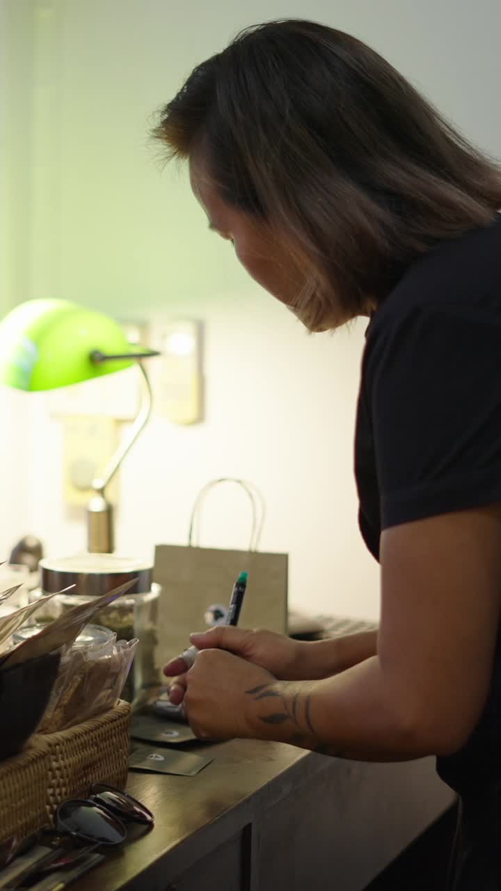 Person writing at desk