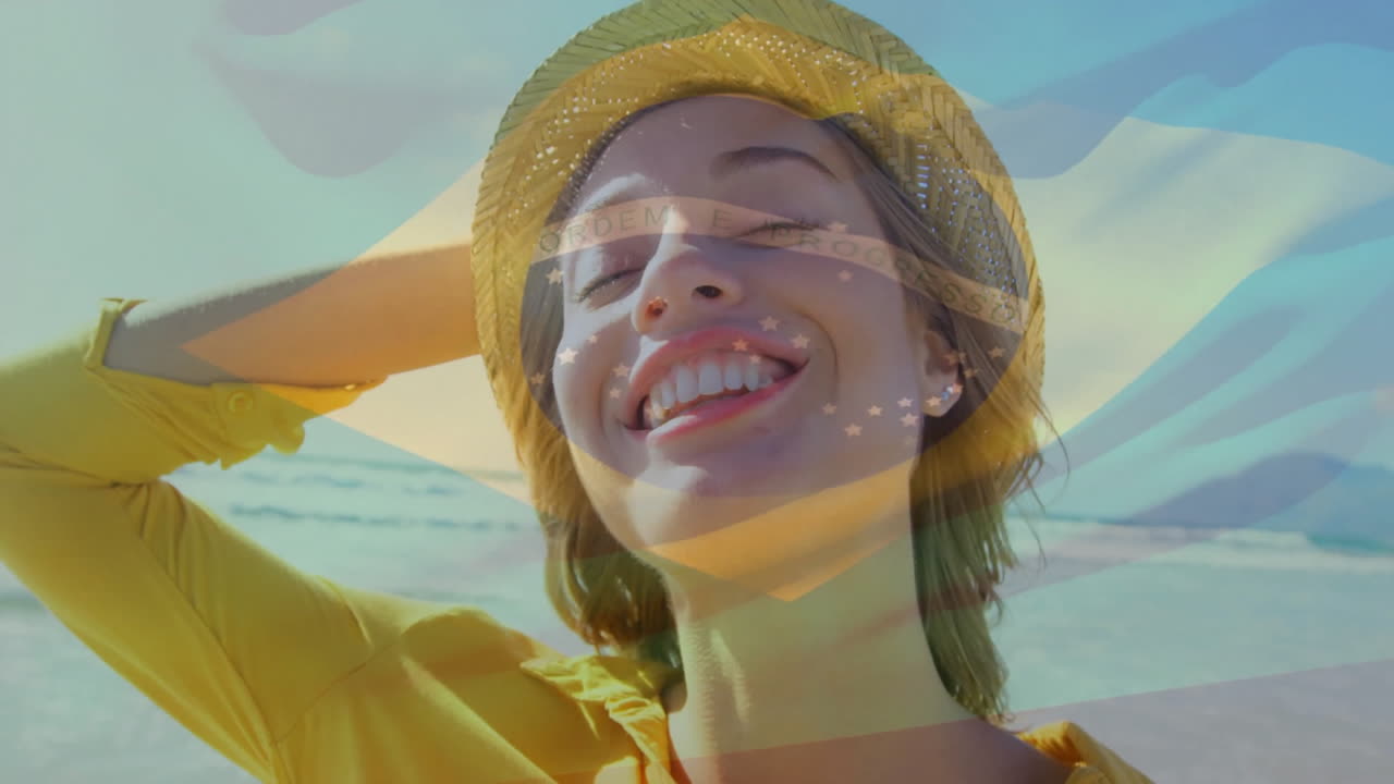 Wearing yellow hat, woman overlaid with Brazilian flag on beach animation