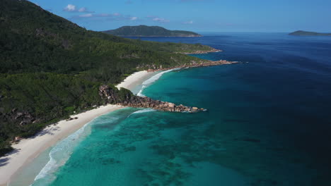 Aerial-views-over-the-white-sandy-beaches-on-La-Digue-Island-in-the-Seychelles,-Africa