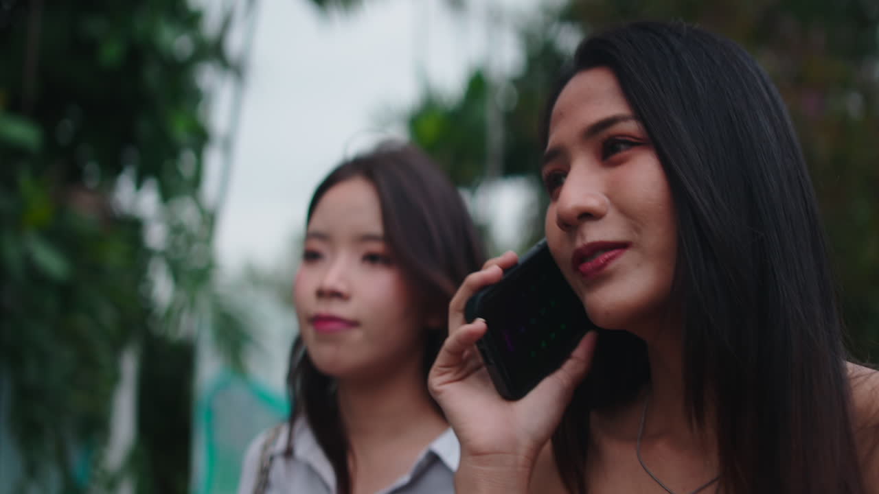 Two women talking on phone