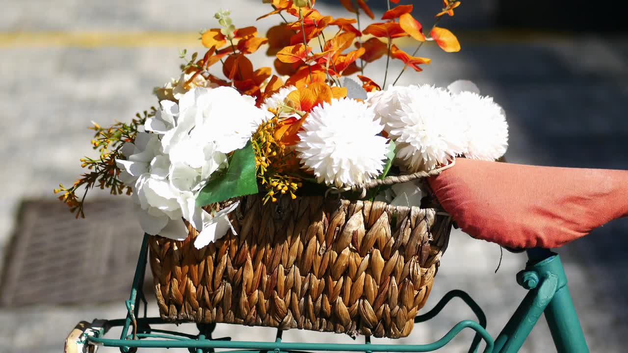 Vintage Teal Bicycle with Flowers in Wicker Basket