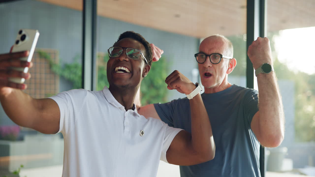 Happy Multi-Generational Men Flexing Muscles and Taking a Selfie