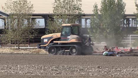 Tractor-ploughing-in-California,-USA