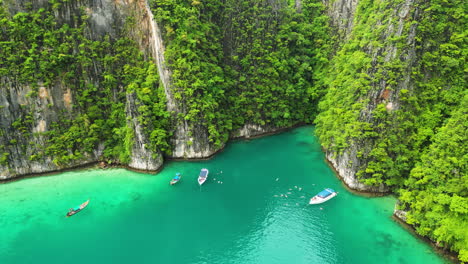 Aerial-over-tourist-diving-vessels-near-Pih-Leh-lagoon-off-Koh-Phi-Phi-Island,-Thailand