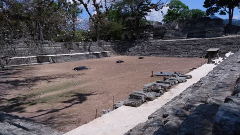 pan across ancient temples in east court at copan ruins in honduras