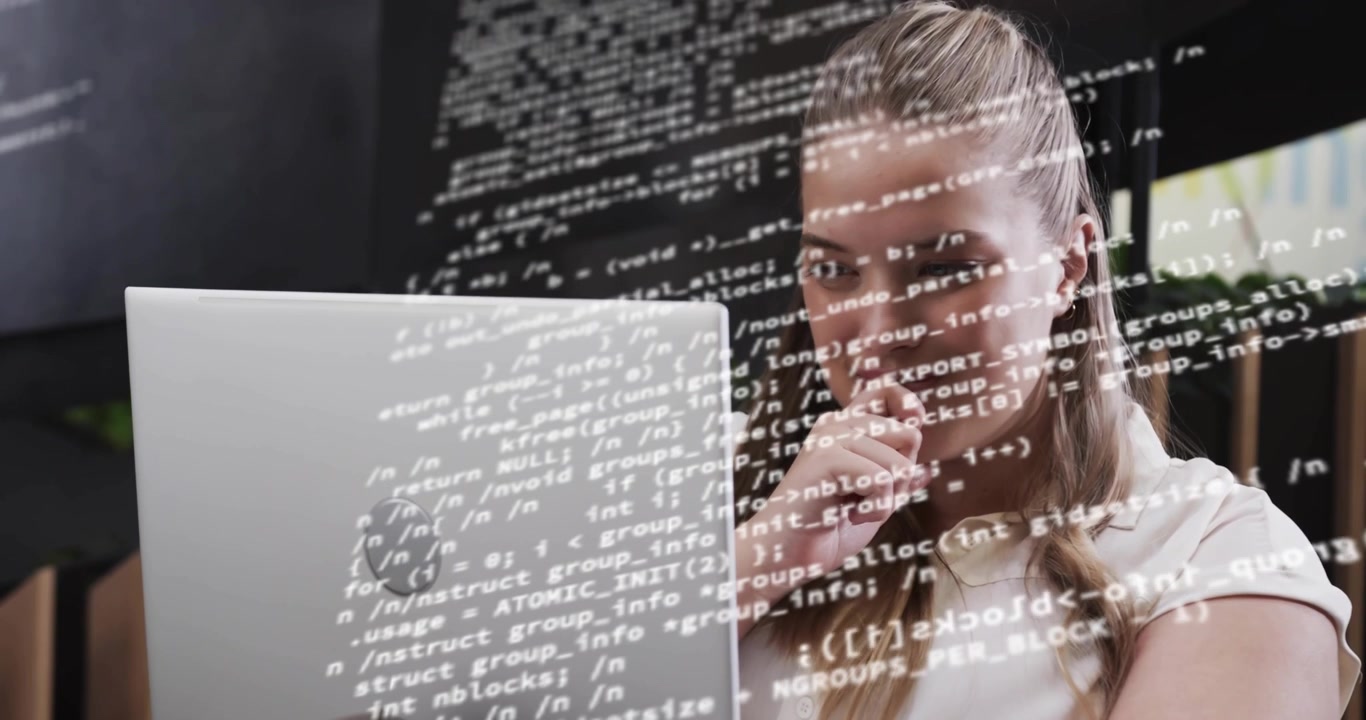 Floating code overlay shifting camera panning revealing coder reviewing code on tech laptop smiling