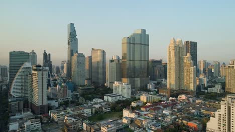 bangkok skyline during golden hour with clear blue skies, aerial view