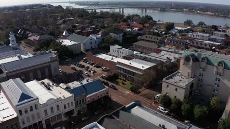 Aerial-tilting-up-shot-to-reveal-the-Natchez-Vidalia-bridge-across-the-Mississippi-River-in-Natchez,-Mississippi