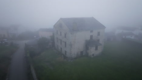 foggy abandoned house in rural village