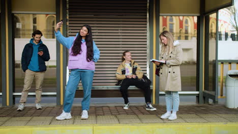 young people at bus stop