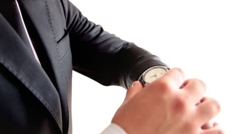 close up businessman hand checking the time on wrist watch