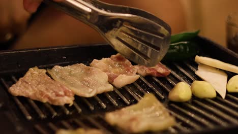 cooking steak and vegetables on a grill