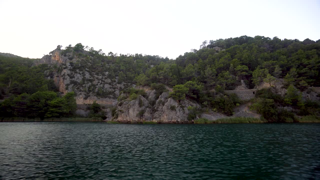 Moving video clip of a cliff along the river in Krka National Park Dalmatia Region Croatia